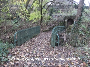 Bridge parapets over drainange ditch.